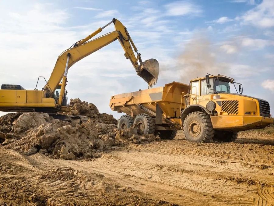 Excavator loading a dump truck